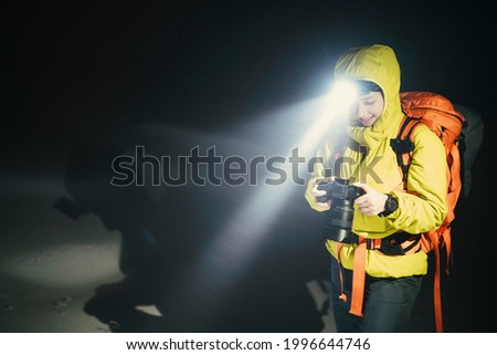 Similar – Image, Stock Photo People hiking at night. Mountains at sunrise. Man standing on peak. Natural mountain landscape with illuminated misty peaks, foggy slopes and valleys