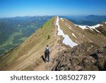 mountaineer walking at the ridge of fellhorn mountain in the allgau alps, destination oberstdorf