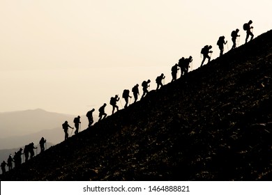 mountaineering activity and a harmonious team together - Shutterstock ID 1464888821