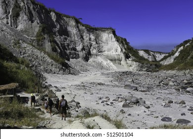 Mountaineers Trekking Across Mount Pinatubo Valley Over Lahar And Pyroclastic Flow Remnants From Its Historic Eruption In 1991
