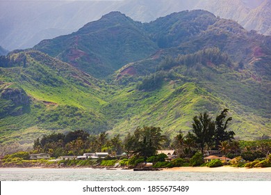 Mountainous east coast Oahu, Hawaii. Koolau Mountain Range above a few residences.