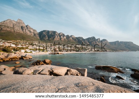 The mountainous landscape of Cape Town South Africa. With Lions Head, the Twelve Apostles and Table Mountain. Located next to the ocean Bantry Bay and Camps Bay are right underneath the mountains. 