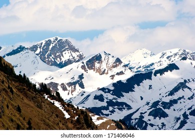 Mountainous landscape in Switzerland with snowy peaks in summer. - Shutterstock ID 171406046
