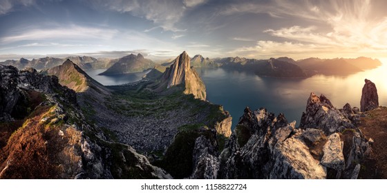 Mountainous panorma landscape view with huge fjords during golden sunset in Senja, Norway - Shutterstock ID 1158822724