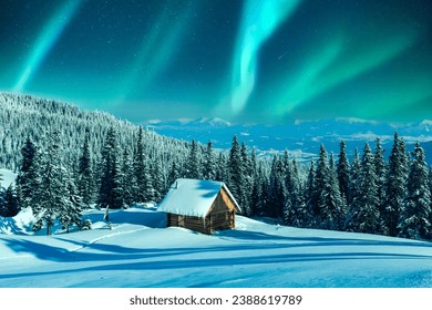 A mountainous winter vista with a rustic cabin and snow-laden pine trees on a meadow. Aurora borealis. Northern lights in winter forest. Christmas holiday and winter vacations concept - Powered by Shutterstock