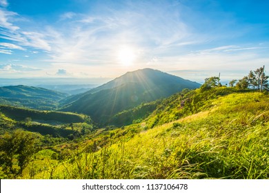 The mountains in the afternoon, with grass and sky with clouds drifting. - Shutterstock ID 1137106478