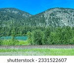 The mountains along the Kootenay River near Libby, MT on a bright sunny day in May,