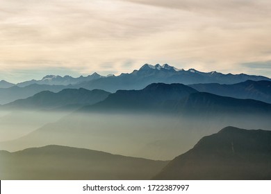 Mountains between clouds, Pico Cristobal Colon, Pico Simon Bolivar, Highest peaks of Colombia at 5700 meters of elevation with snow on top, viewed from Cuchilla San Lorenzo - Powered by Shutterstock