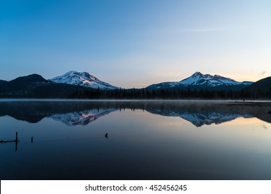 Mountains in the cascade Range of Oregon reflected in a lake