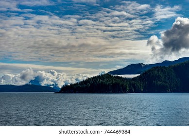 Mountains covered in clouds on a misty morning on the Ferry towa - Powered by Shutterstock