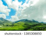 Mountains covered with thick clouds before the heavy rain at daytime. Sichuan, China.