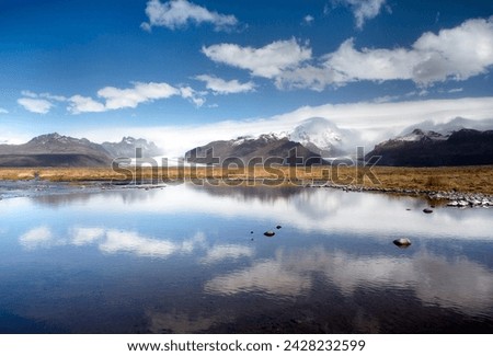 Mountains and glaciers on the edge of the vatnajokull ice cap near skaftafell national park, reflecting in a nearby lake, south iceland, iceland, polar regions