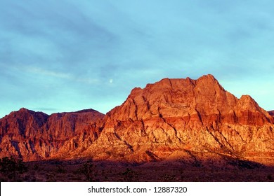 The Mountains Glow Fiery Red At Sunrise In Red Rock Canyon Las Vegas Nevada.