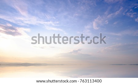 Mountains landscape at sunrise - cloudy sky in pastel colors for your design