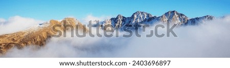 Mountains minimalist landscape. Peaks of the mountains above the clouds. Pyrenees, Andorra, Europe. Horizontal banner