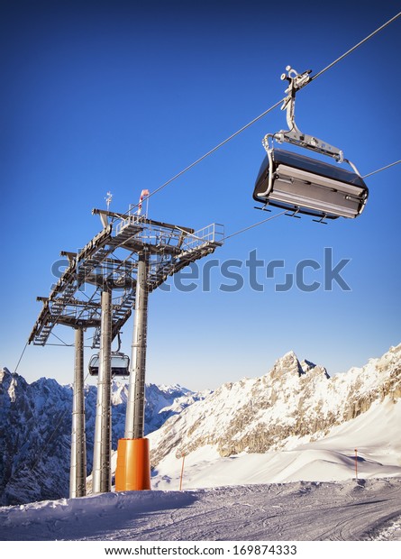 mountains with modern ski lift\
chair