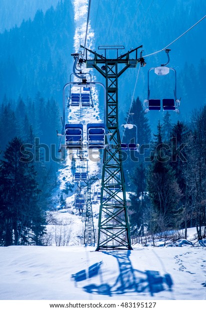 mountains with modern ski lift\
chair