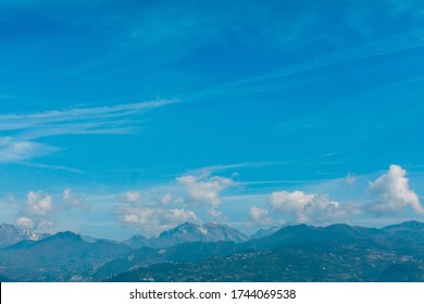 Mountains over which clouds float. Cloudy sky. Landscape.