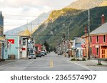 Mountains overlooking the old city center of Skagway, Alaska - Symmetric view of Broadway, the main shopping street of this Frontier town in the Klondike Gold Rush National Historic Park