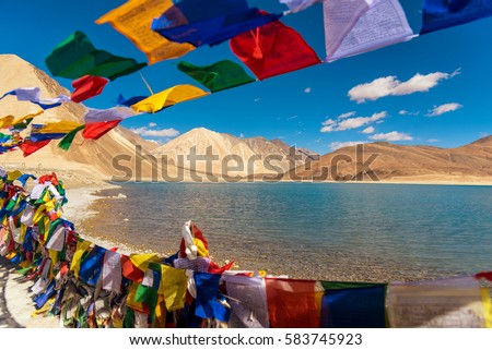 Mountains and Pangong tso (Lake). It is huge and highest lake in Ladakh and blue sky in background, it extends from India to Tibet. Leh, Ladakh, Jammu and Kashmir, India