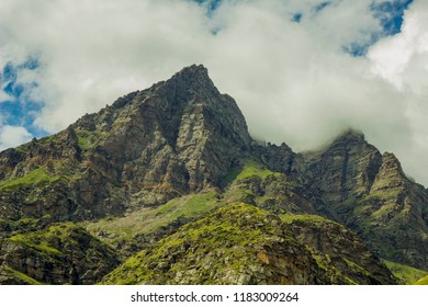 mountains peak in the clouds