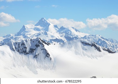 Mountains with peaks covered with snow,  Caucasus - Shutterstock ID 678522295