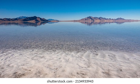 Mountains reflected in the Great Salt Lake near Slat Lake City - Shutterstock ID 2134933943