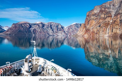 Mountains reflection,Expedition cruise ship in  Sam Ford Fjord, Arctic Canada, Nunavut