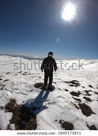 Mountains, skier posing in gear