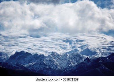 
mountains, snow and clouds