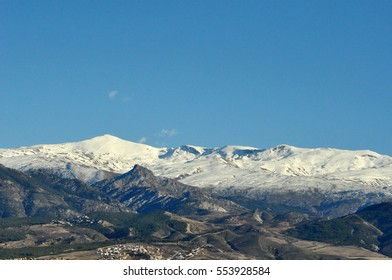mountains with snow and clouds