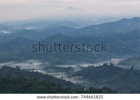 mountains under mist in the morning with beautiful sky in Phu Phaya Pho, Phrae Province, Thailand