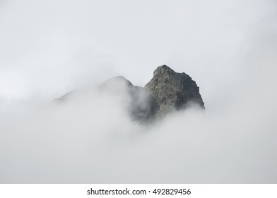 Mountaintop In Fog