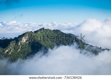 Mountaintop stand out from the sea of mist. The beautiful scenic as reward for tourist who able to success climbing.