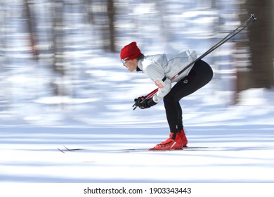 Mount-Saint-Bruno National Park, Québec, Canada, January 26 2021, Cross-country Skiier Downhill Action