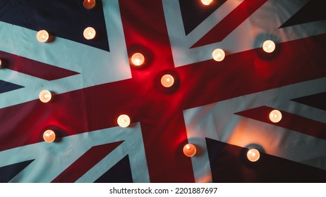 Mourning candles on Queen flag of England