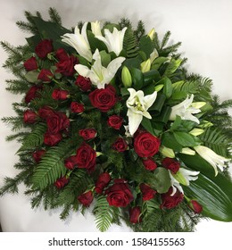 Mourning Wreath For Funeral. Red, Green And White Flowers.