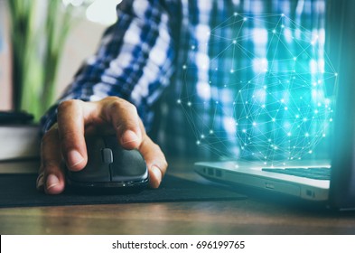 mouse click, man hand with mouse and laptop - Shutterstock ID 696199765