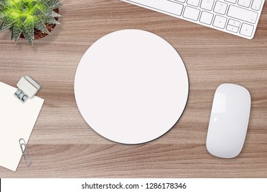 Mouse pad mockup. Round white mat on the table with props, mouse and keyboard - Shutterstock ID 1286178346