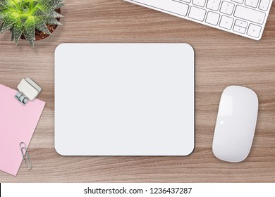 Mouse pad mockup. White mat on the table with props.