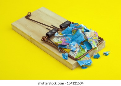 Mouse Trap With A Trapped And Broken World Concept On Yellow Background