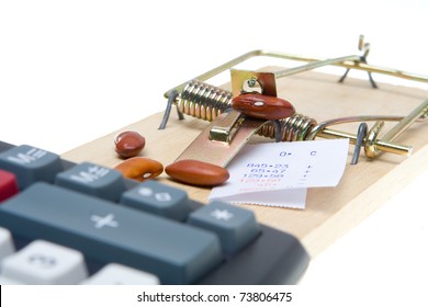 Mousetrap baited with beans and adding machine tape to trap an accountant.  Isolated on white background.