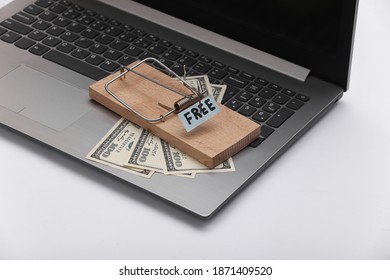 Mousetrap With Free Bait And Dollar Bills On Laptop Keyboard. Trap, Money Scam, Internet Fraud