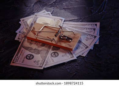 Mousetrap With Free Bait And Dollar Bills On A Grey Background. Trap, Money Scam Concept