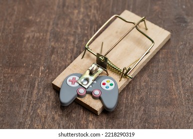 Mousetrap With Gamepad. Gambling Addiction Concept