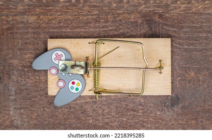 Mousetrap With Gamepad. Gambling Addiction Concept