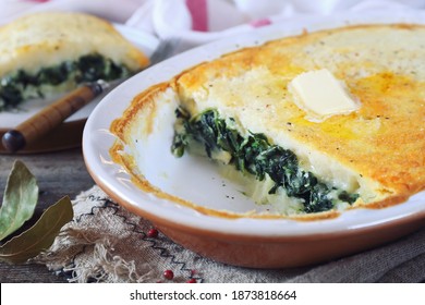 Moussaka. Potato Casserole (gratin) With Spinach In Ceramic Pot. Greek Cuisine. Vegetarian Dish