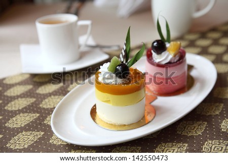 Pink chocolate mousse in pie crust and half cut in slices