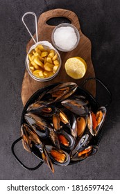 Moussels And French Fries Or Molues-frites On Black Slate. Typical Belgian Food.