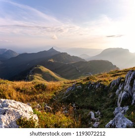 Moutain Range At Sunset Above Grenoble In Isere, France. There Is Haze In The Background